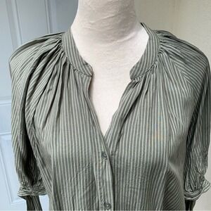 AMANDA GREEN. Green striped shirt, short sleeves with ties around sleeves.XL